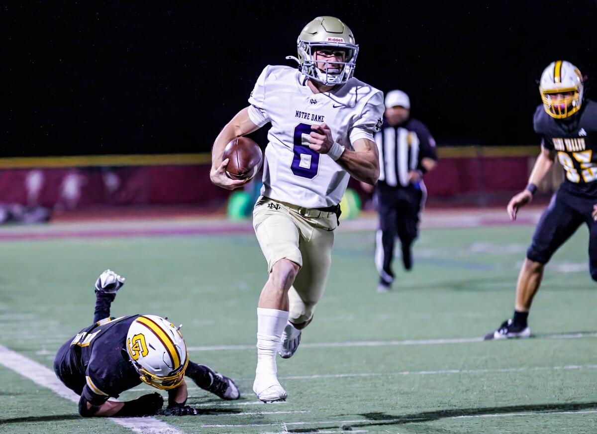 Sherman Oaks Notre Dame quarterback Steele Pizzella leaves defenders in his wake on a big run.