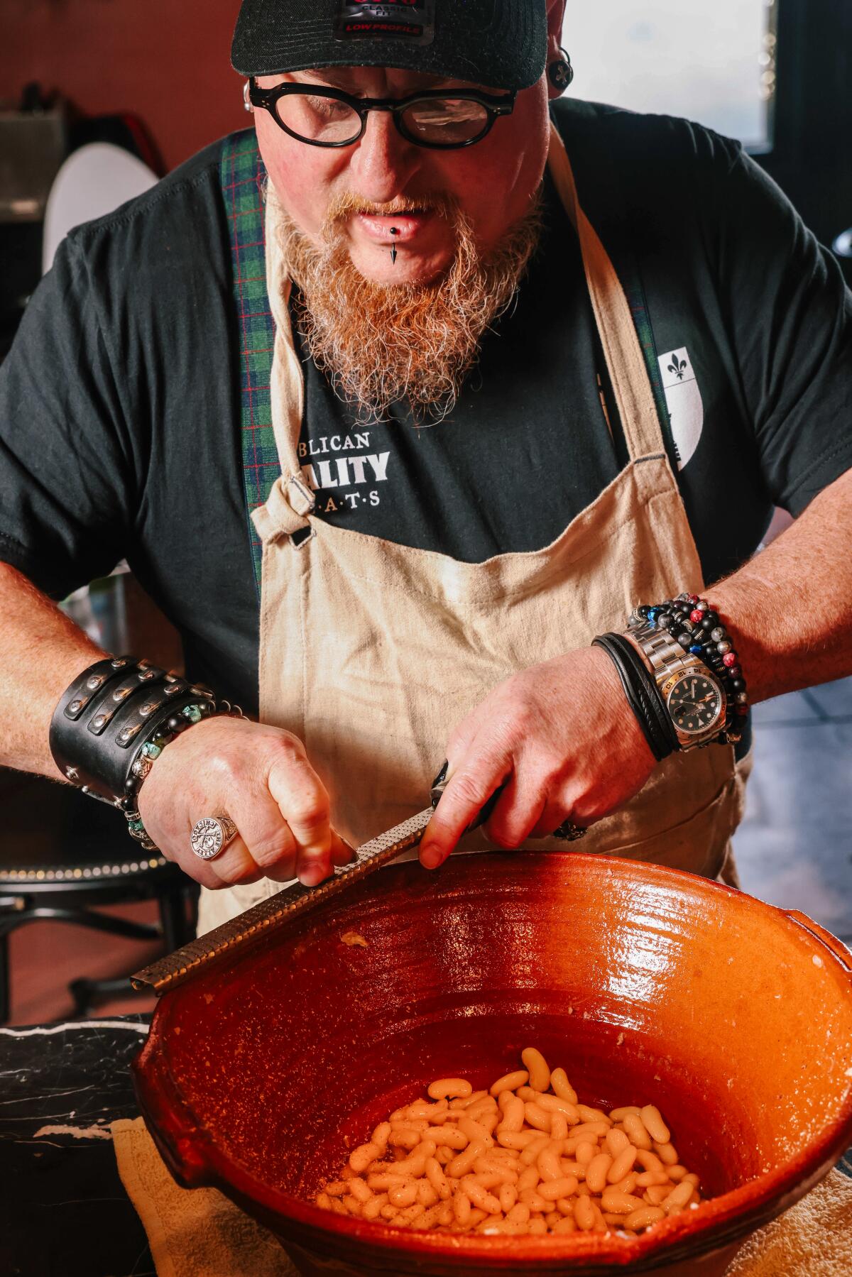 Chef David Campigotto shaves fresh nutmeg for his cassoulet 