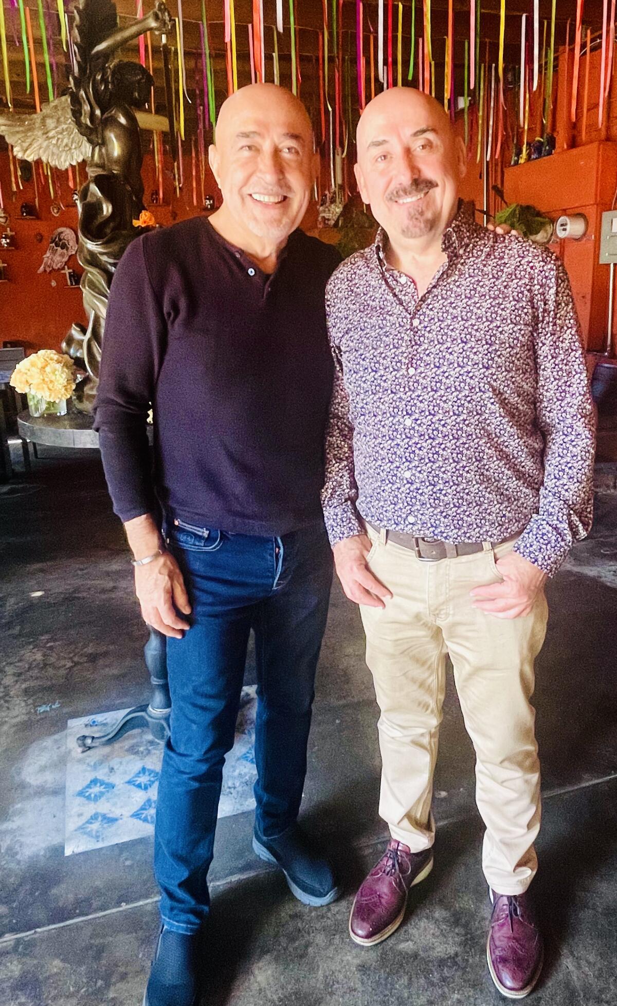 The chef-owners of La Casita Mexican in Bell, Jaime Martin del Campo, left, and Ramiro Arvizu in the restaurant's patio.