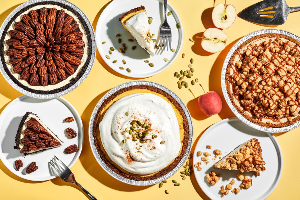 An overhead photo of three Sweet Rose Creamery ice cream pies and slices on plates against a pale yellow background