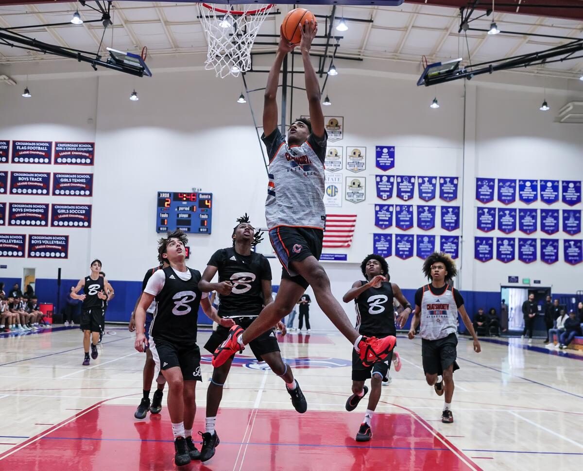 Alijah Arenas of Chatsworth elevates toward the rim on a breakaway.