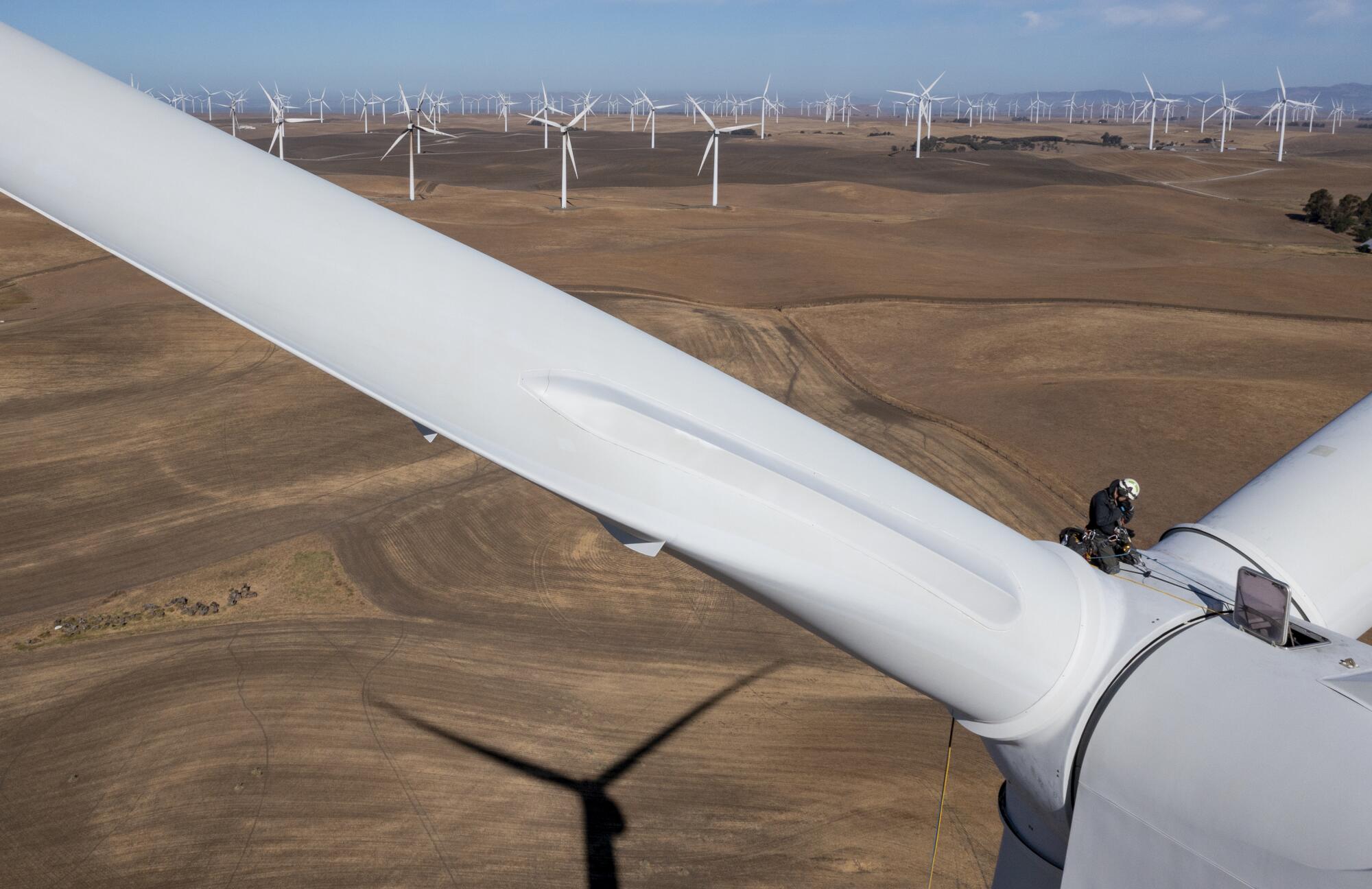 A close-up of the blades of a wind turbine.