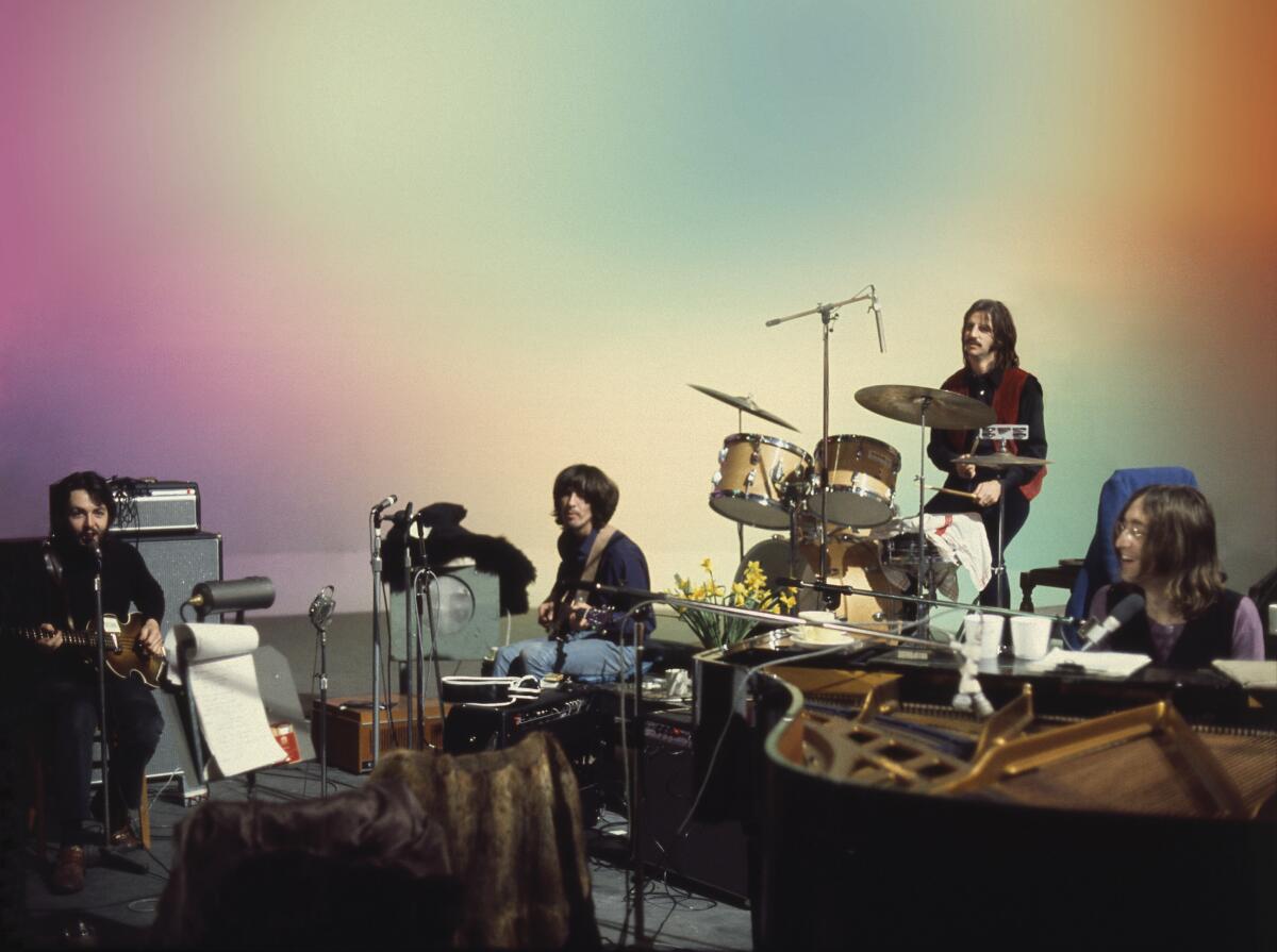 The Beatles performing on a soundstage