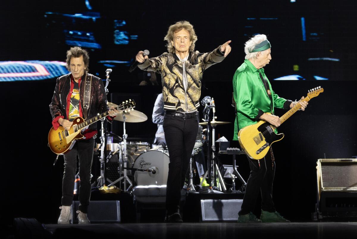 The Rolling Stones perform onstage.