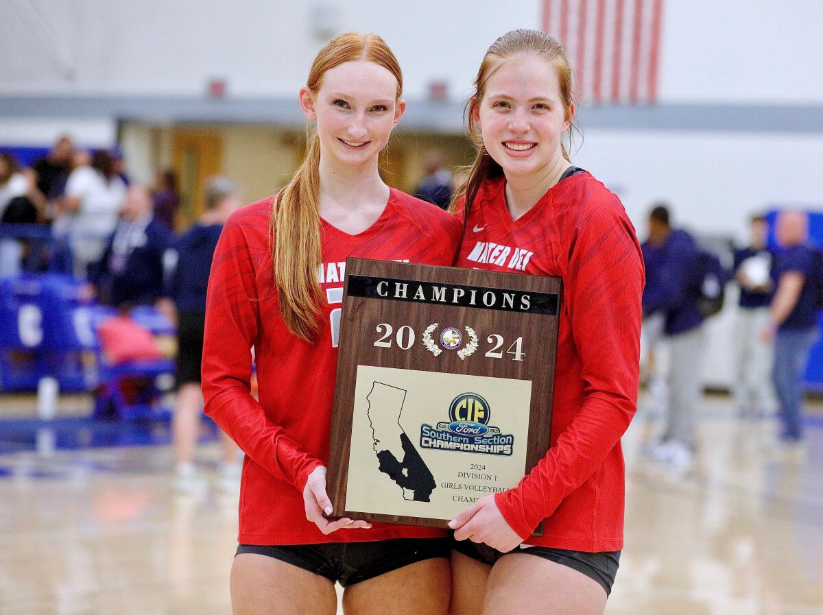 Mater Dei volleyball players Addison Coady (left) and Emma Kingston celebrate.