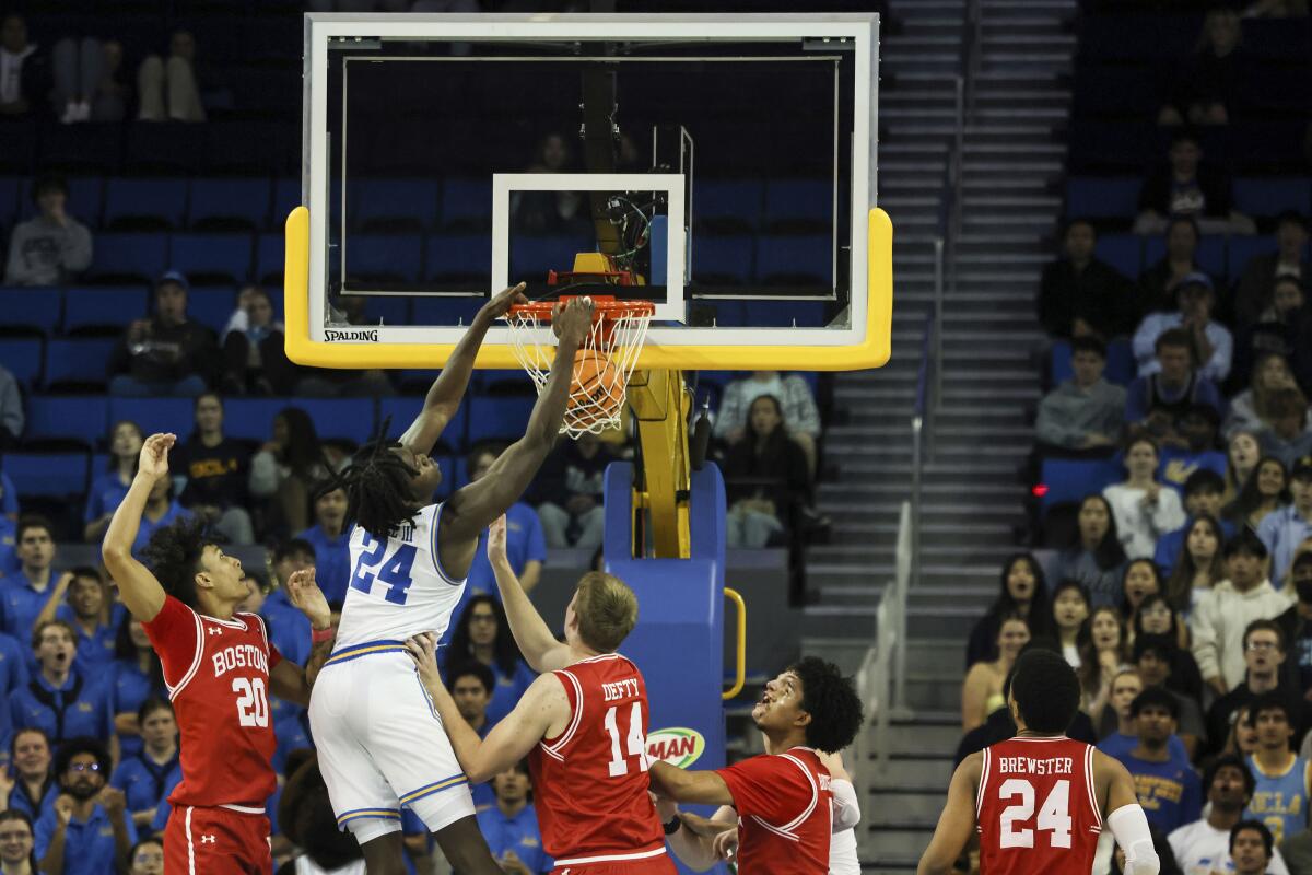 UCLA's William Kyle III dunks during the blowout victory Monday night