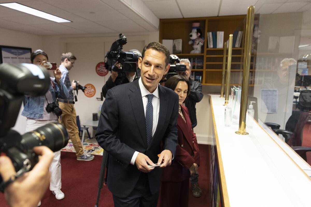 Daniel Lurie, philanthropist and Levi Strauss heir, smiles at news cameras