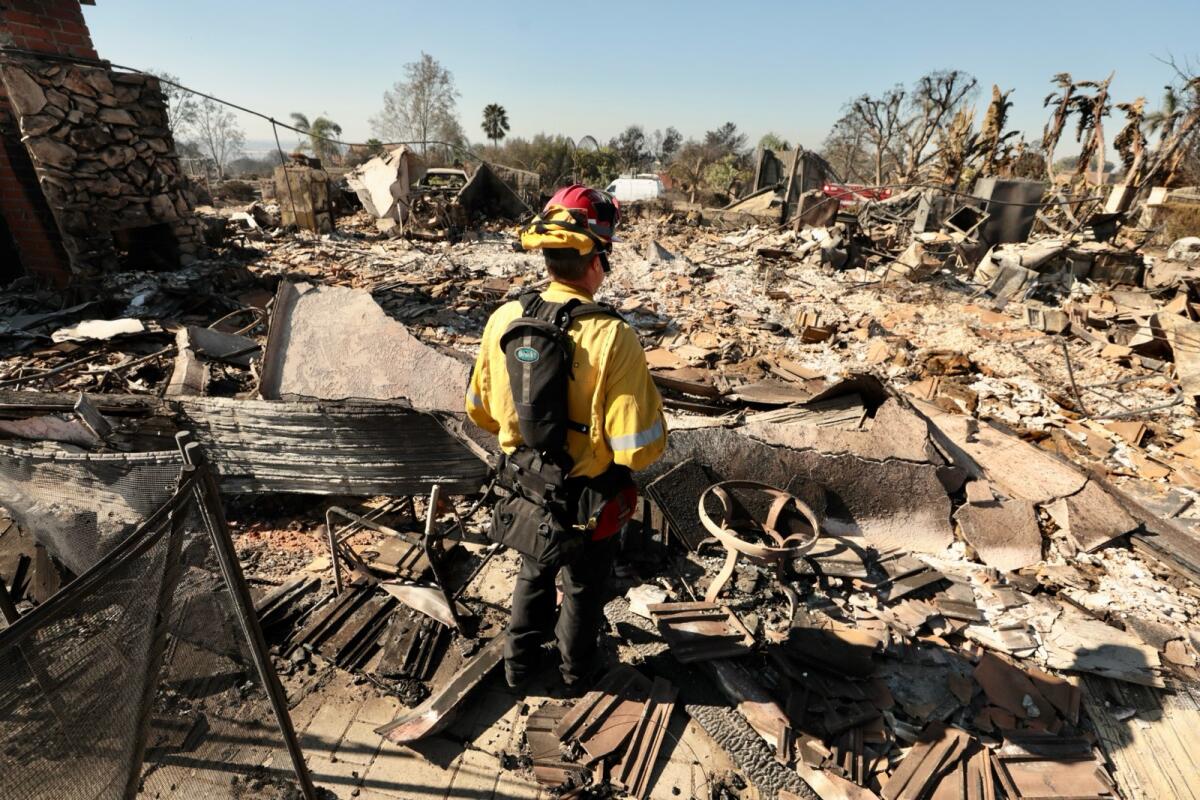 Fire Capt. Kevin Kennedy surrounded by rubble