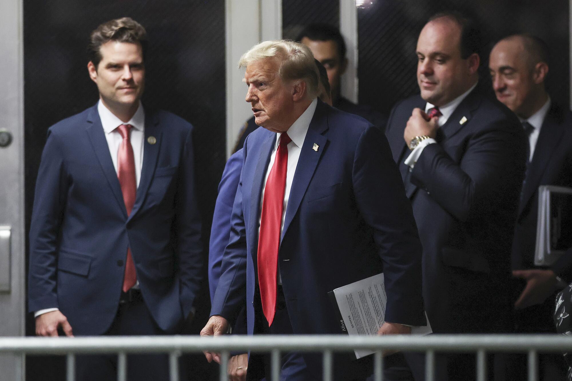 Matt Gaetz with Donald Trump outside the New York courtroom where Trump was convicted of 34 felonies in May.