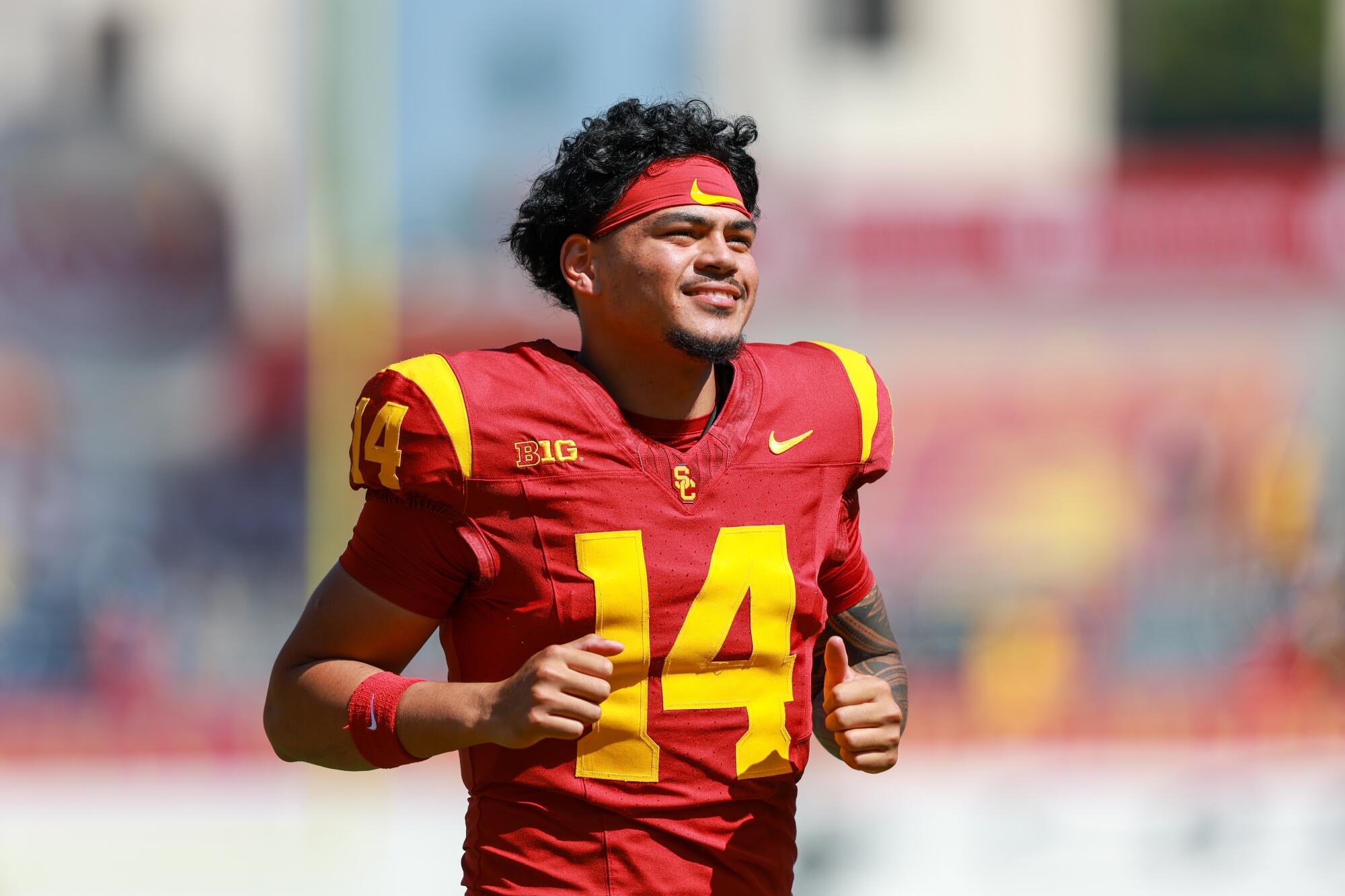 USC quarterback Jayden Maiava runs off of the field during a game against Wisconsin on Sept. 28 at the Coliseum.