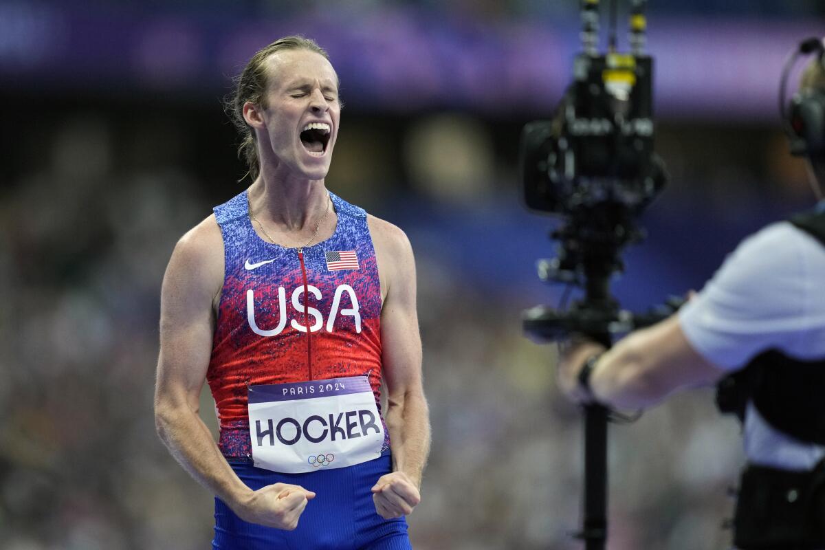 Cole Hocker of the United States exults after winning the gold medal in the men's 1500 meters at the 2024 Summer Olympics.