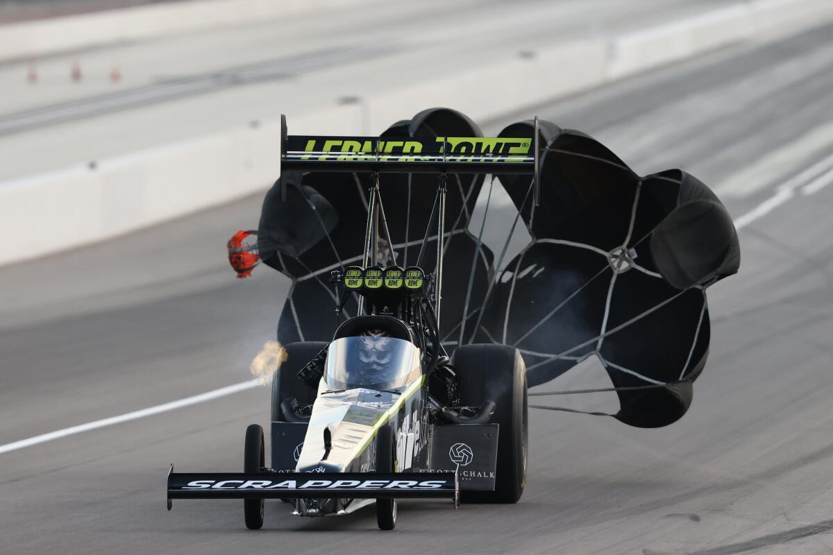 Travis Shumake crosses the finish line during a top fuel dragster run at the Ford Performance NHRA Nationals.