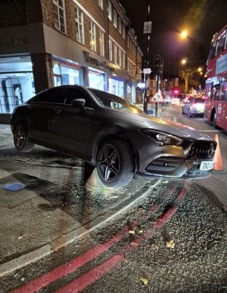 A Mercedes collided with a bollard on the pavement after illegally cutting through an accessway to avoid Verdant Lane traffic