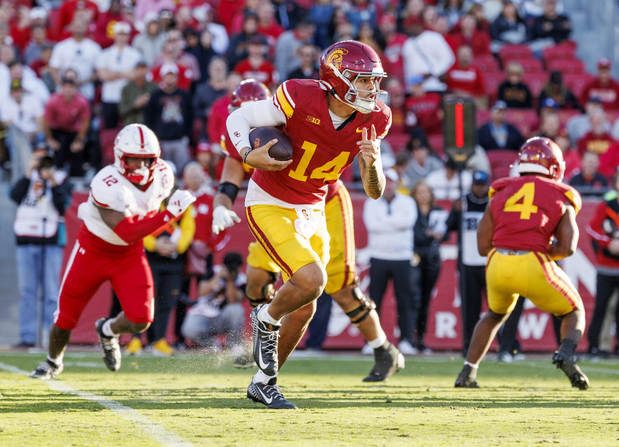 USC quarterback Jayden Maiava runs with the ball during the second half Saturday against Nebraska at the Coliseum.