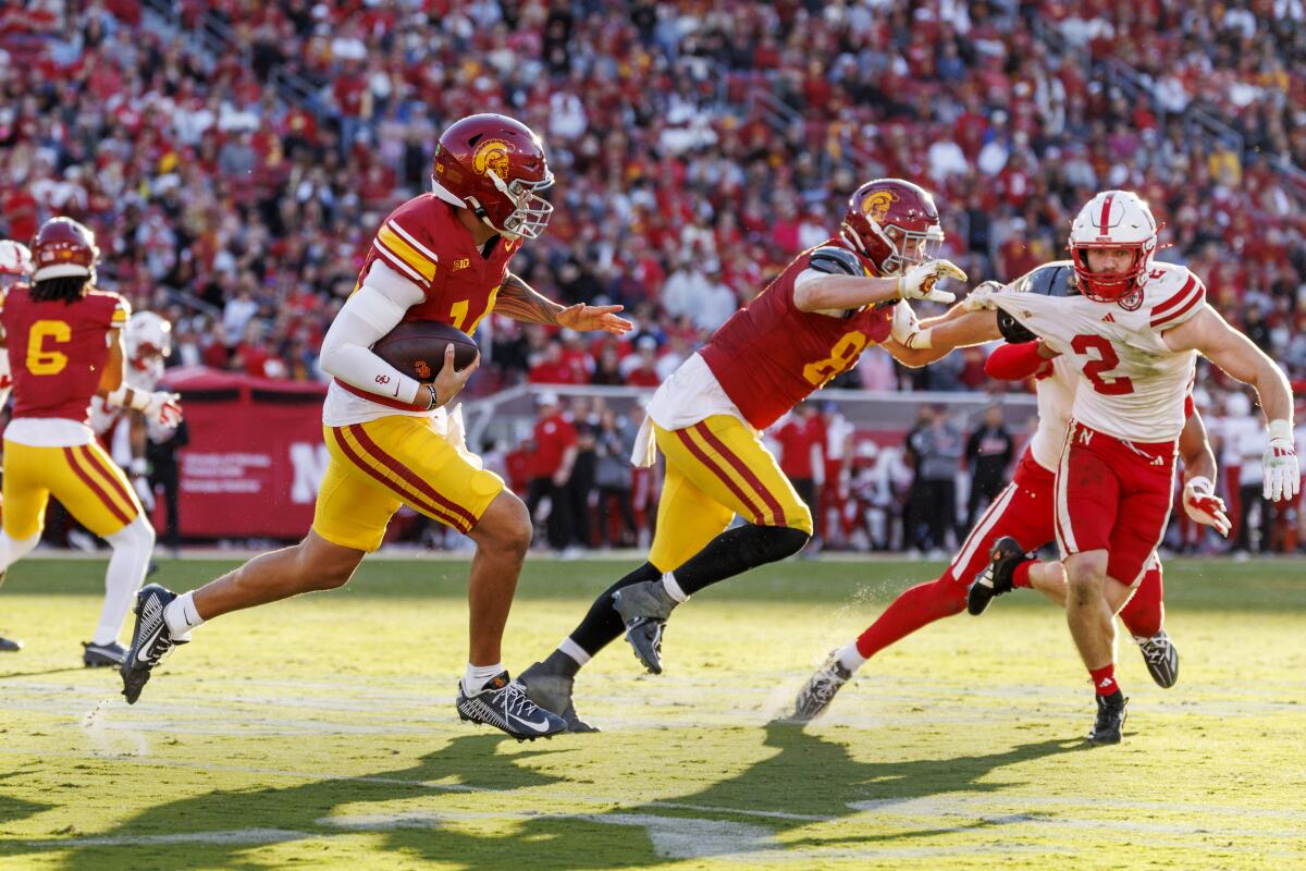 USC quarterback Jayden Maiava runs with the ball.