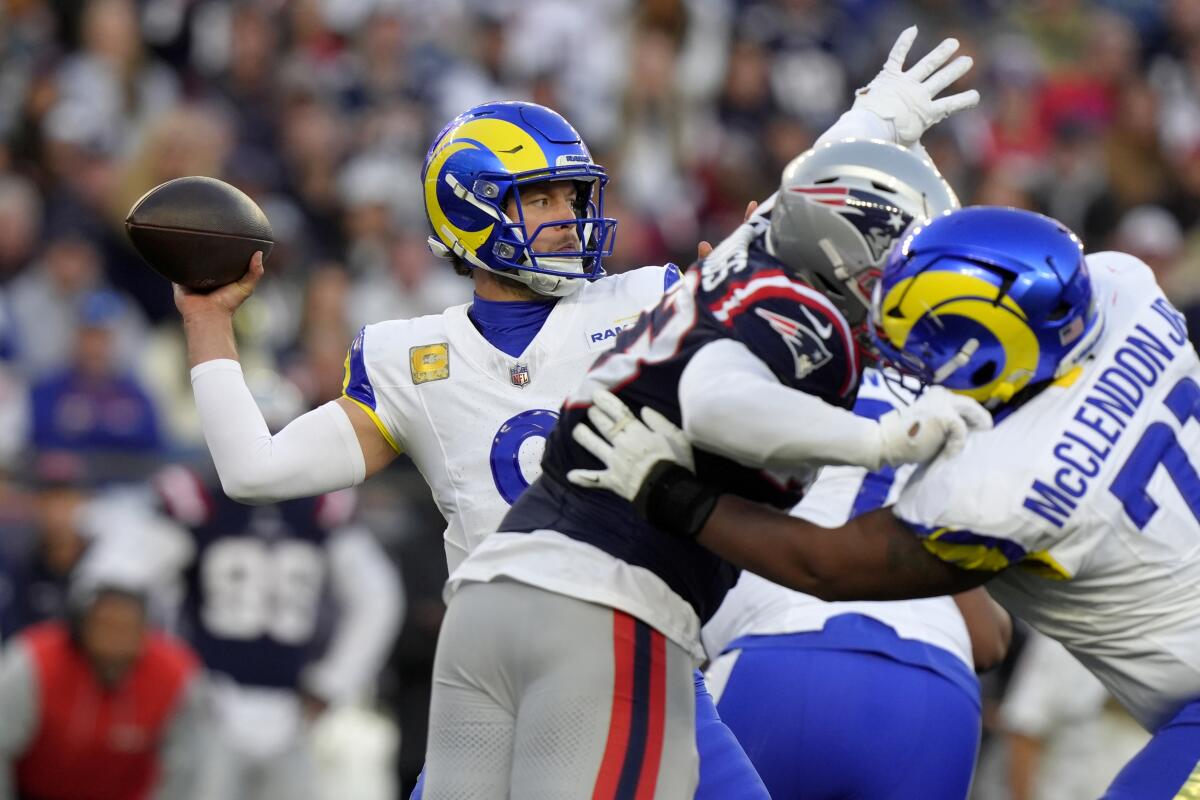 Rams quarterback Matthew Stafford throws under pressure against the New England Patriots.