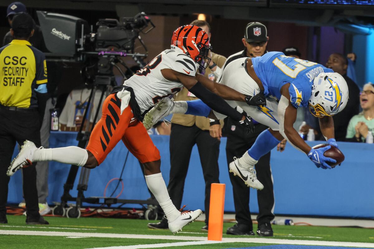 Chargers running back J.K. Dobbins dives into the end zone for the game-winning touchdown.