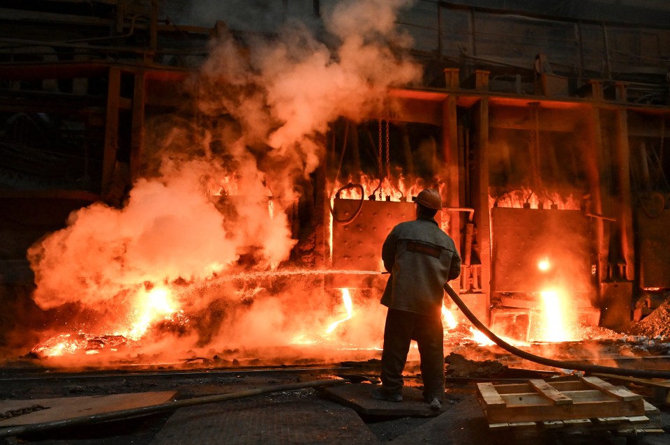 A fireman works to put out a fire caused by a Russian attack on Ukraine