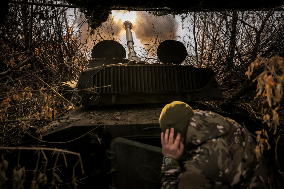 A Ukrainian soldier fires a self-propelled howitzer towards Russian positions in the Donetsk region