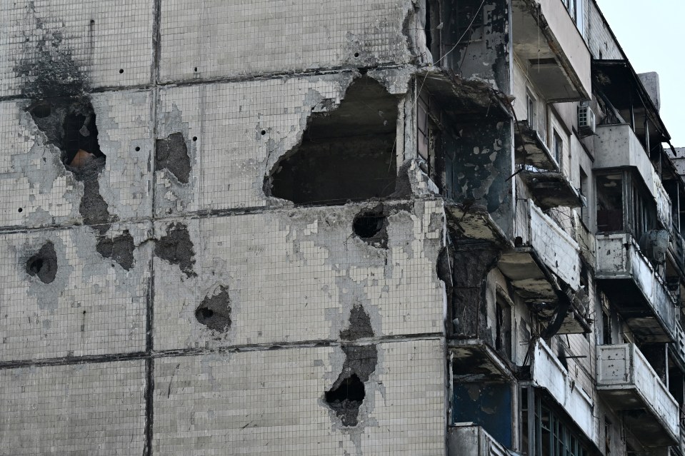 A heavily damaged residential building in Kyiv