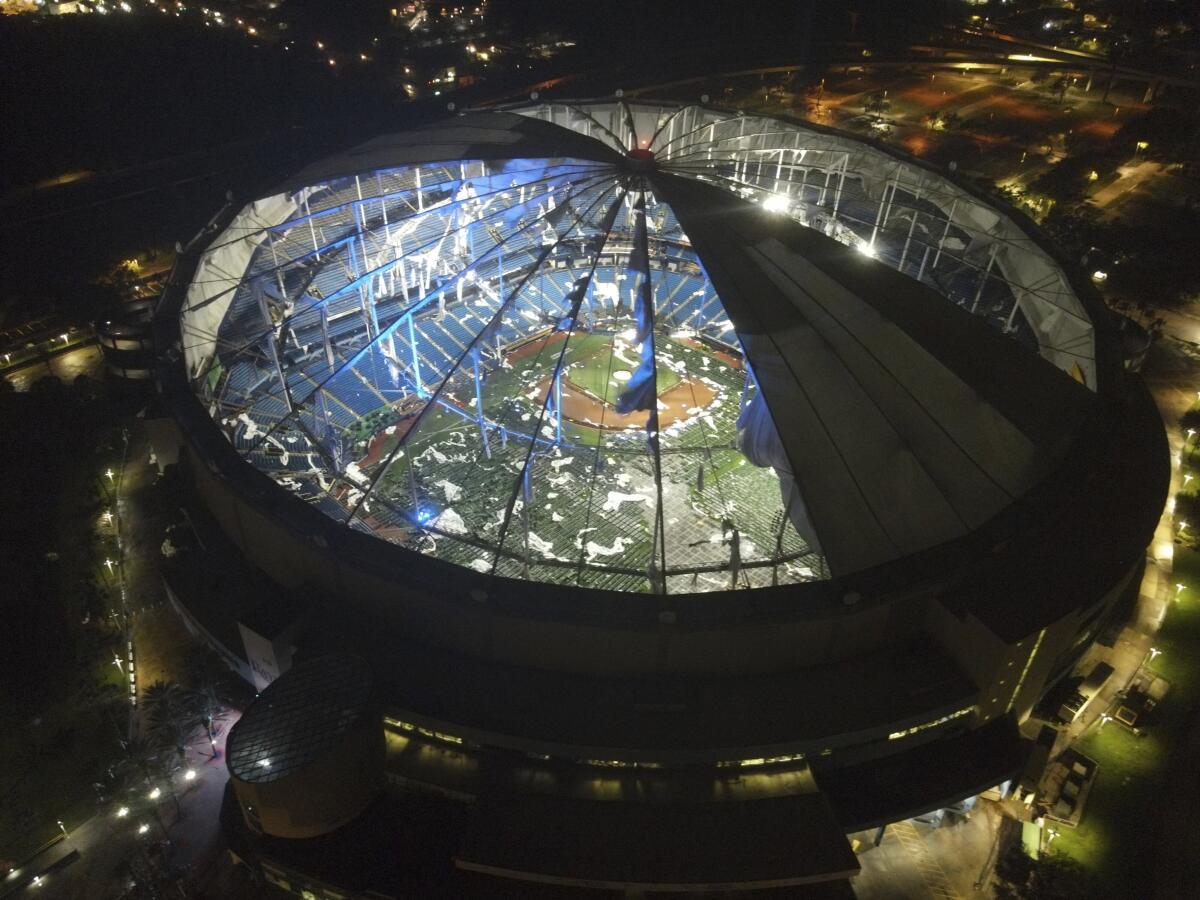 An aerial view of Tropicana Field's shredded roof in downtown St. Petersburg, Fla., in the wake of Hurricane Milton.