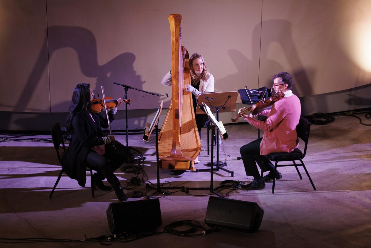 The RedKoral trio performs outside Disney Hall, in the Keck Amphitheater, as part of "Noon to Midnight."