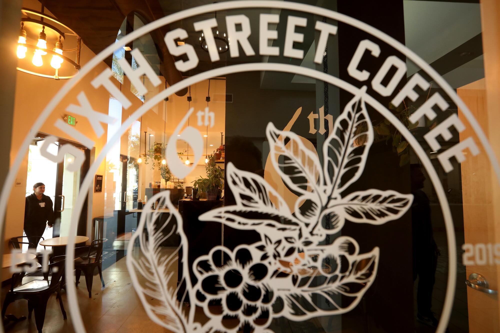 A customer enters Sixth Street Coffee in downtown Coachella.