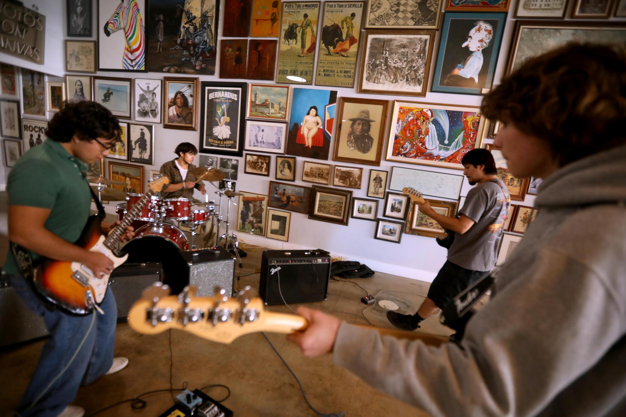 The Knu Haven band rehearses for a gig inside Urban Donkey Vintage store in downtown Indio.