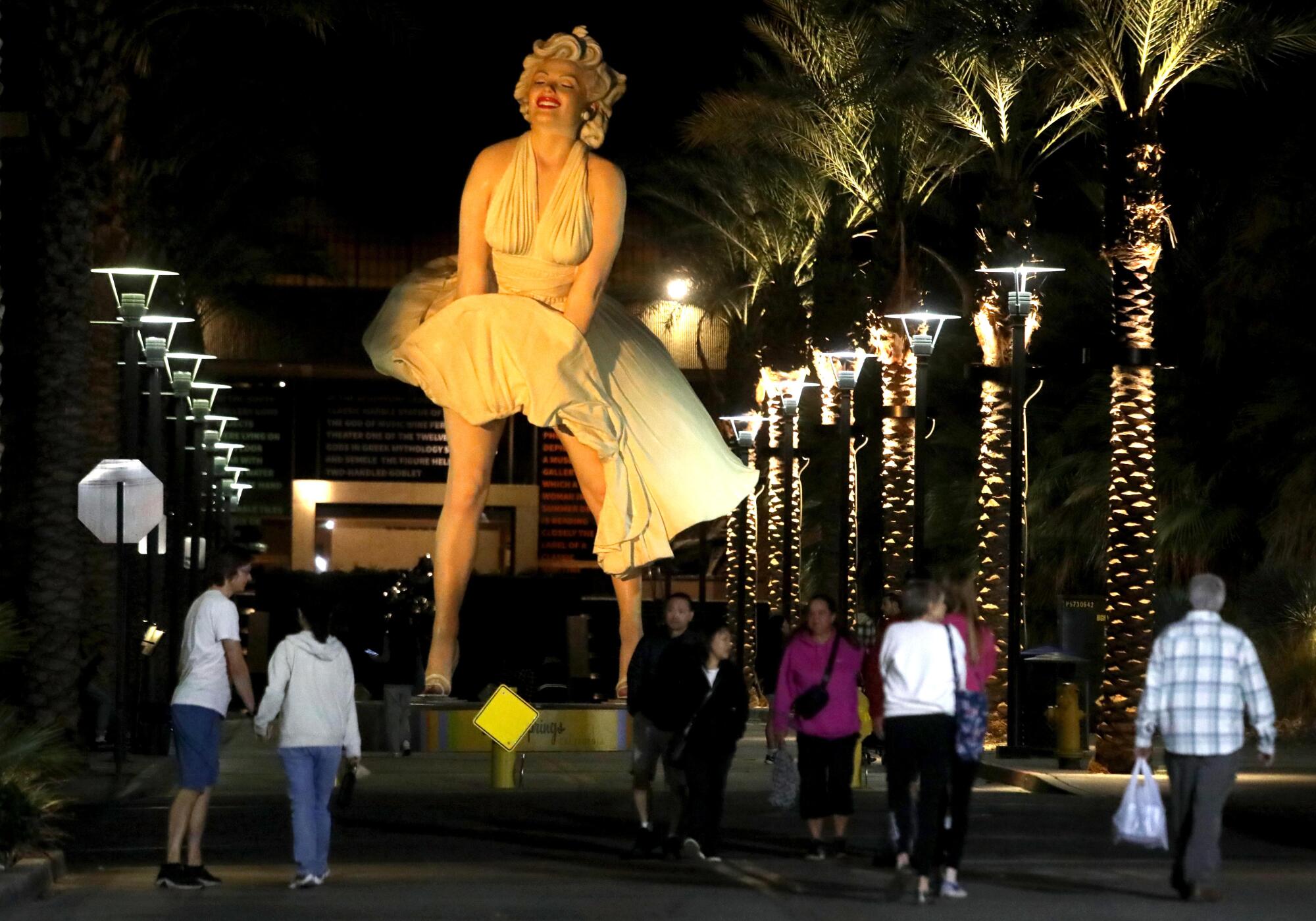 The "Forever Marilyn" giant statue towers over attendees at  the weekly Palm Springs Village fest along Museum Way.