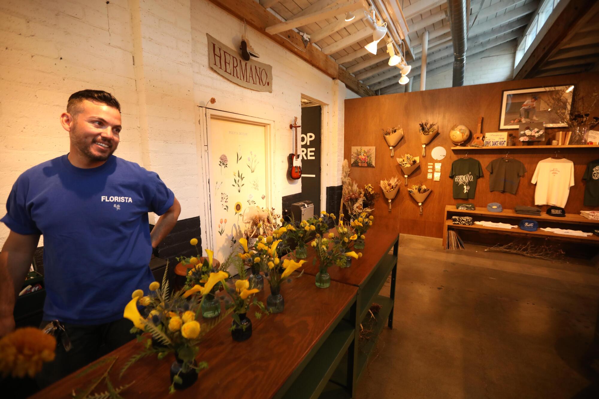 Sesar Orozco works on a floral arrangement for a customer at Hermanos flower shop in Palms Springs.