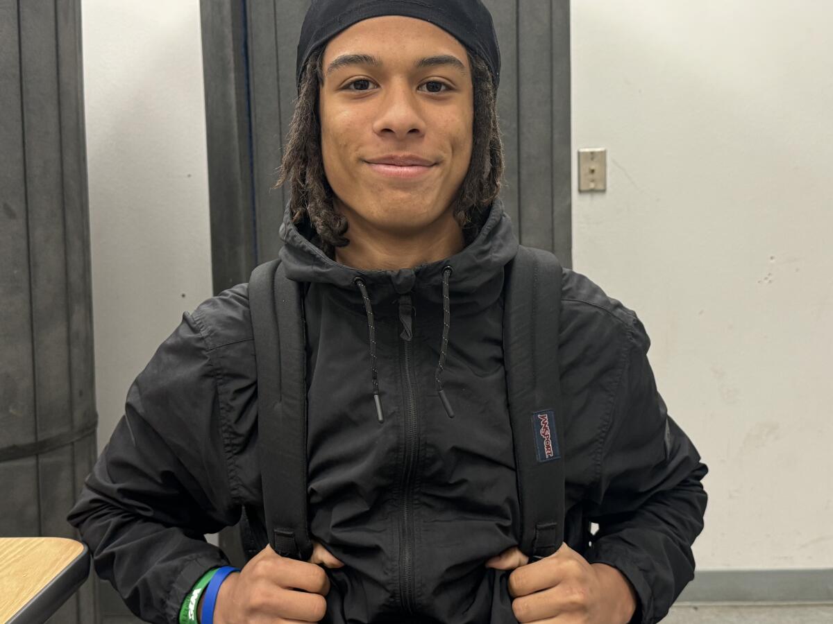 Amare Rhodes poses for a photo while carrying his backpack at Kennedy High in Granada Hills.