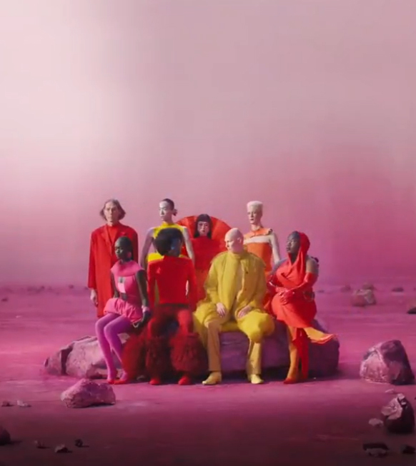 The colourful advert features a range of models in bold outfits