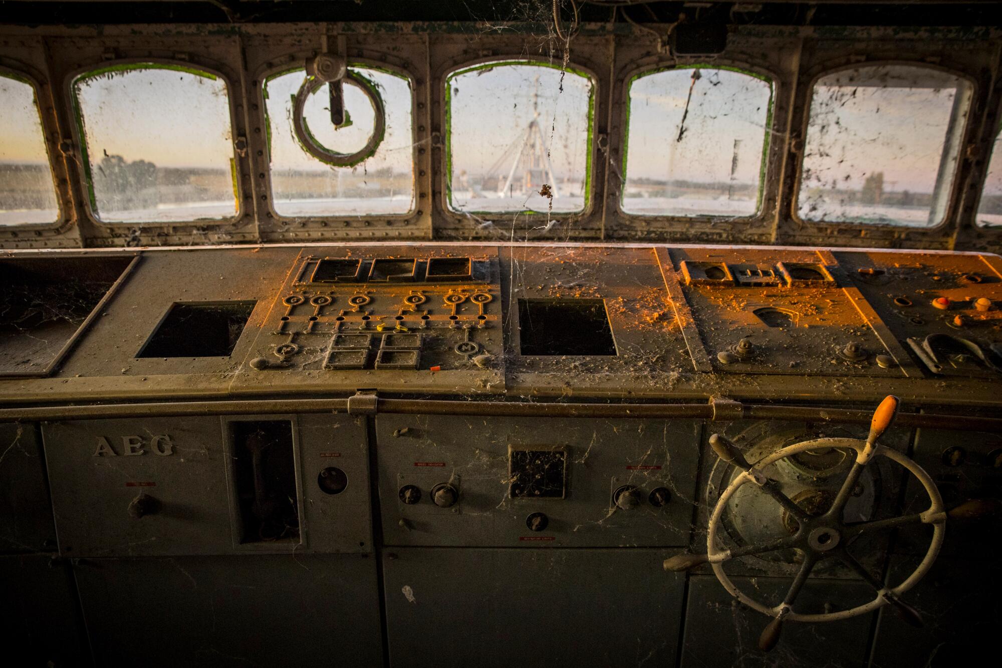 Rust and grime coat the inoperative instrument panel on the Aurora's bridge.