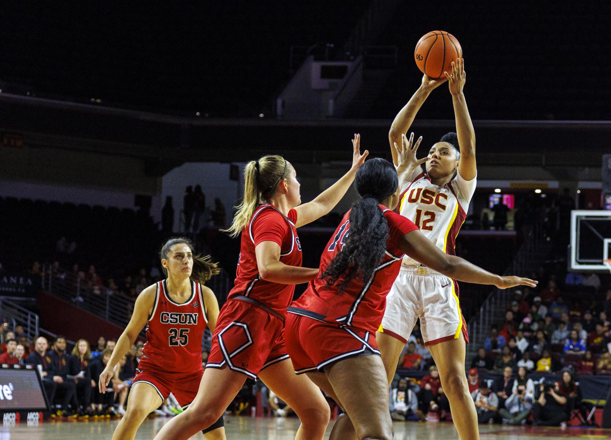 USC guard JuJu Watkins shoots over a Cal State Northridge double-team during a blowout win at the Galen Center 