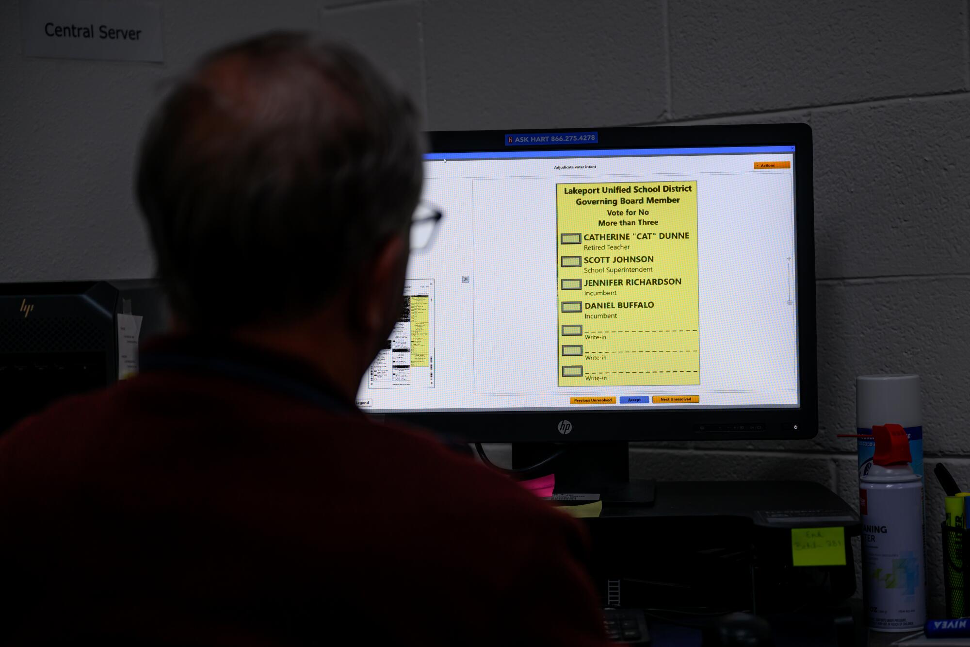 Jim Emenegger processes ballots at the Lake County Registrar of Voters office.