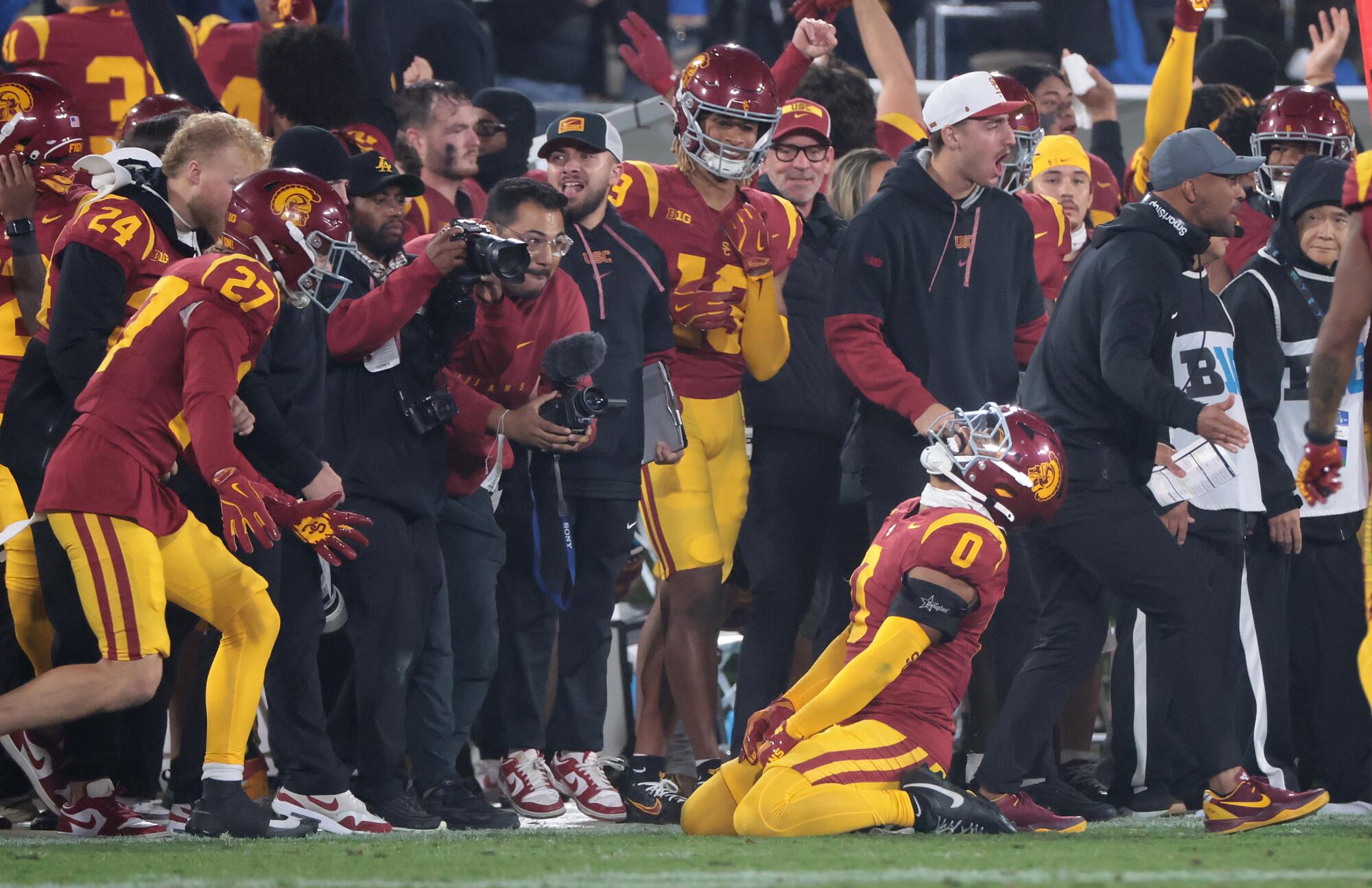 USC safety Akili Arnold celebrates as UCLA turns the ball over on downs late in the fourth quarter at the Rose Bowl 