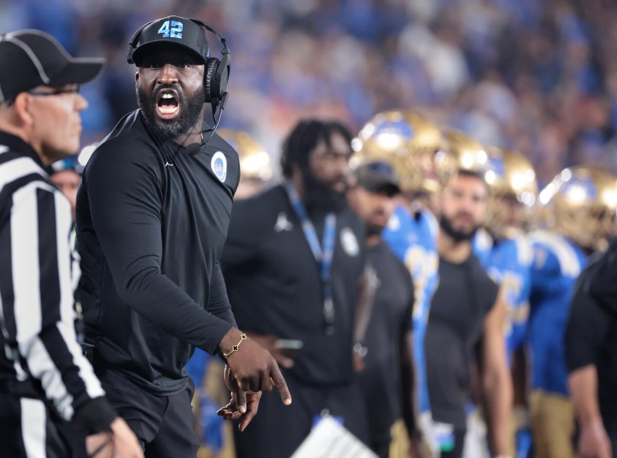 UCLA coach DeShaun Foster argues with a referee during his team's loss USC at the Rose Bowl Saturday.