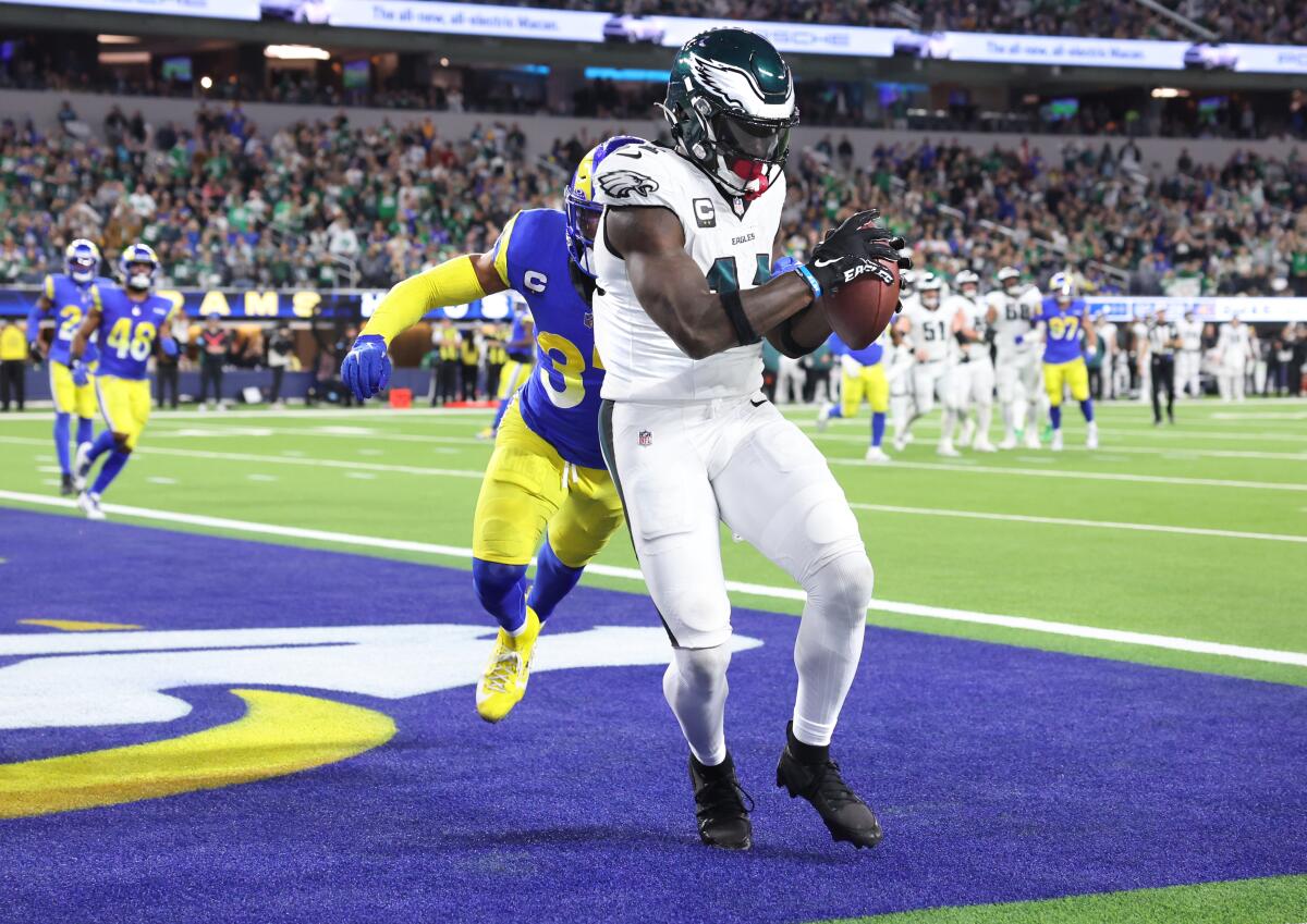 A.J. Brown catches a touchdown pass past Rams safety Quentin Lake to give the Eagles the halftime lead.