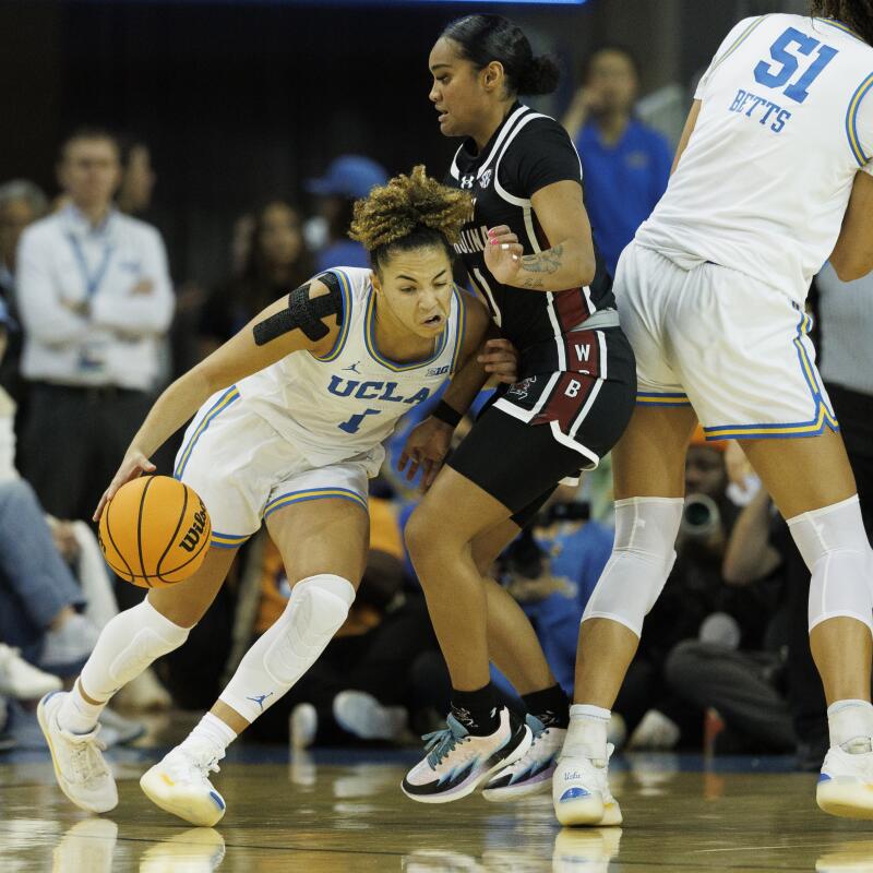 UCLA's Kiki Rice drives to the basket against South Carolina's Te-Hina Paopao.