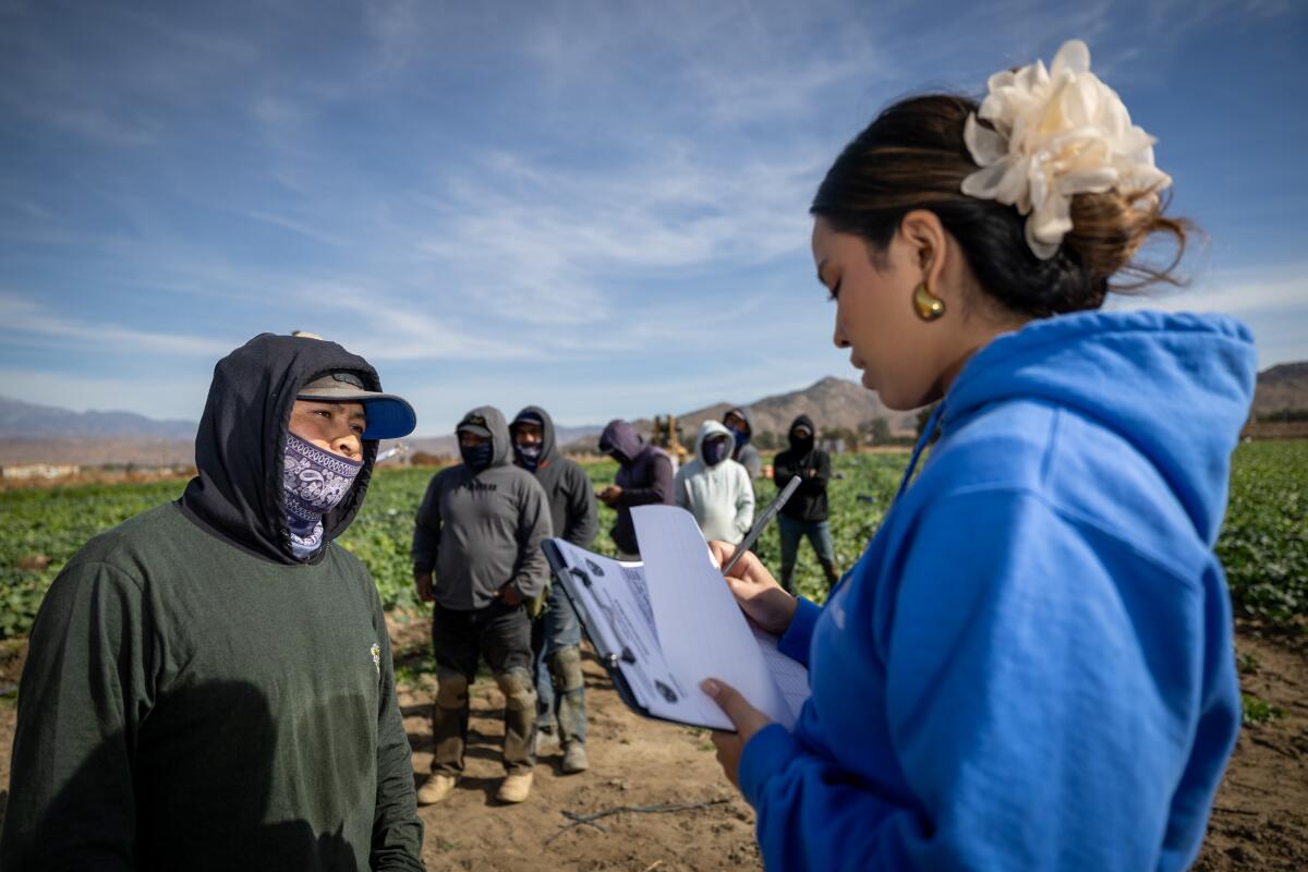 Farmworkers receive information about their rights should mass deportation efforts proceed.