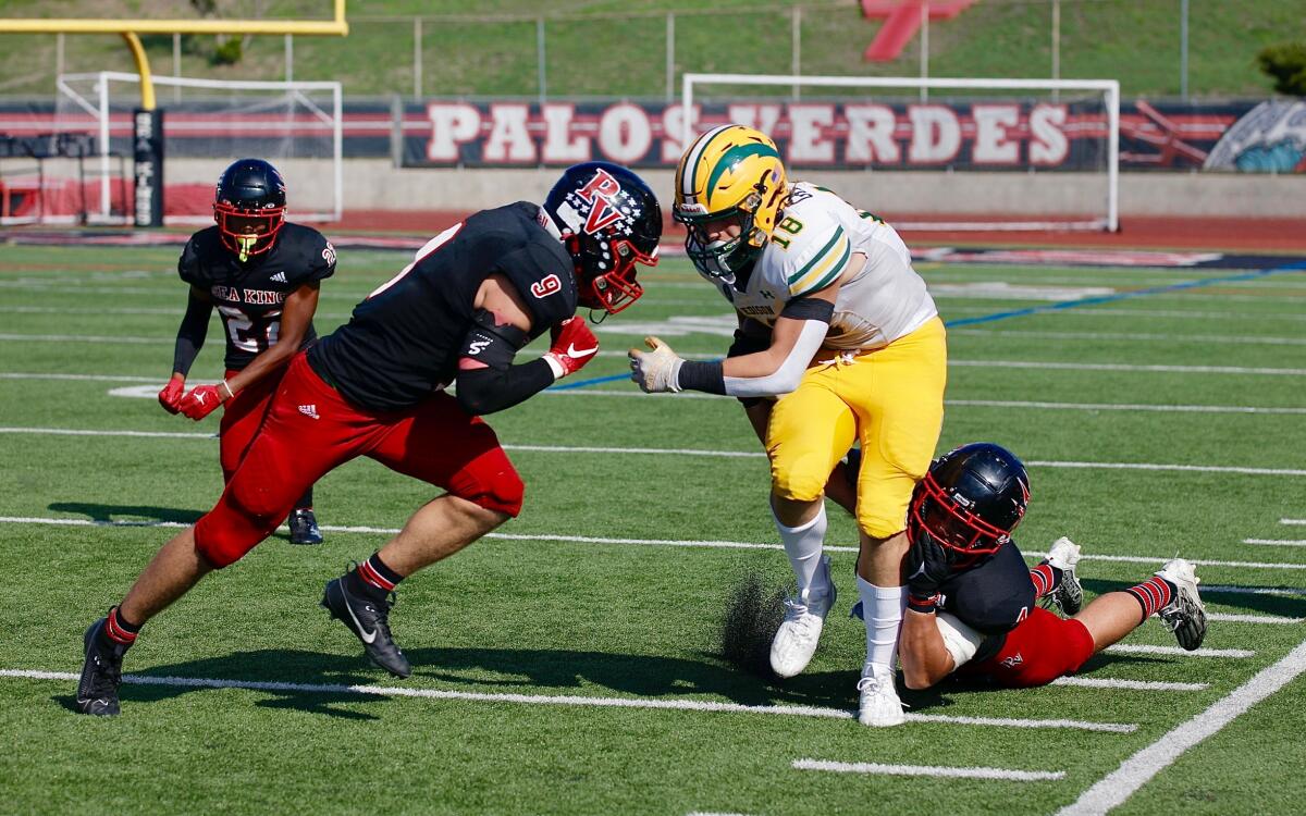 Edison running back Julius Gillick fights for yardage before being knocked out of bounds.