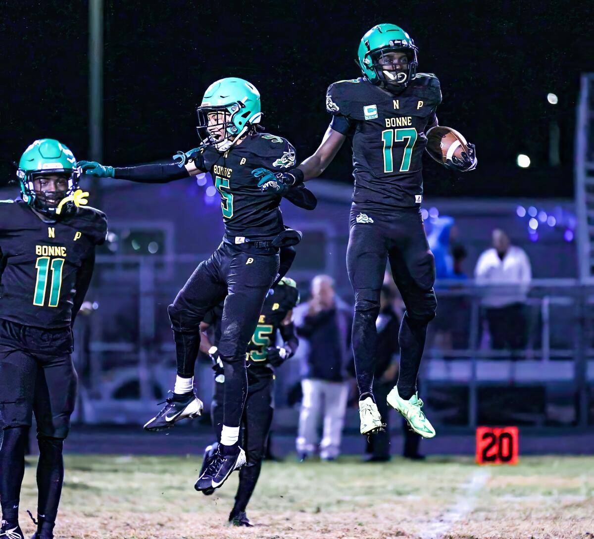 Ernest Nunley (17) makes the interception to start celebration with Narbonne teammates.