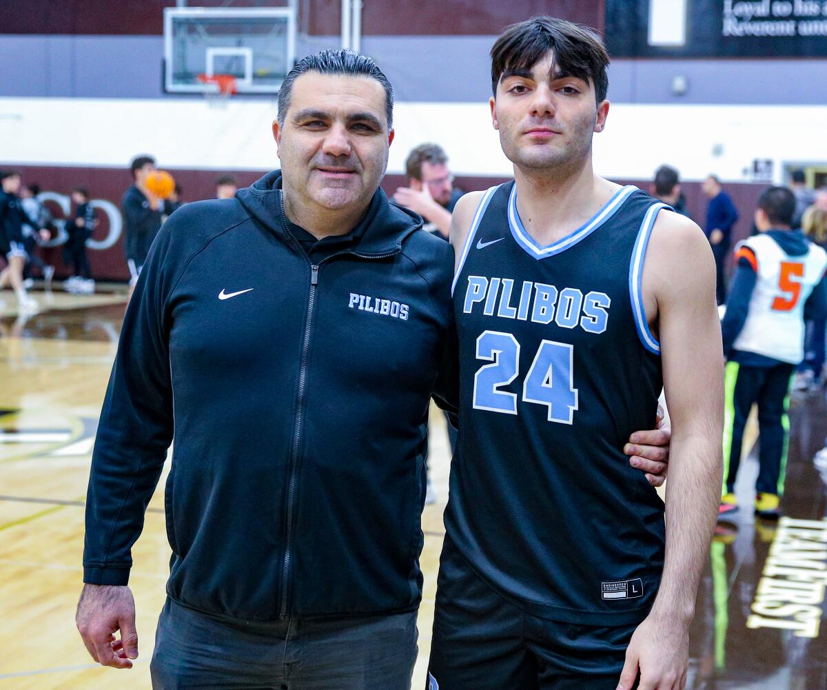 Pilibos coach Sarkis Balian standing courtside with son Anto