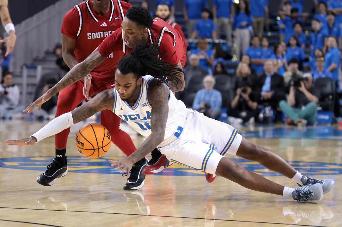 UCLA's Sebastian Mack dives for loose ball against Southern Utah's Tavi Jackson in the second half.