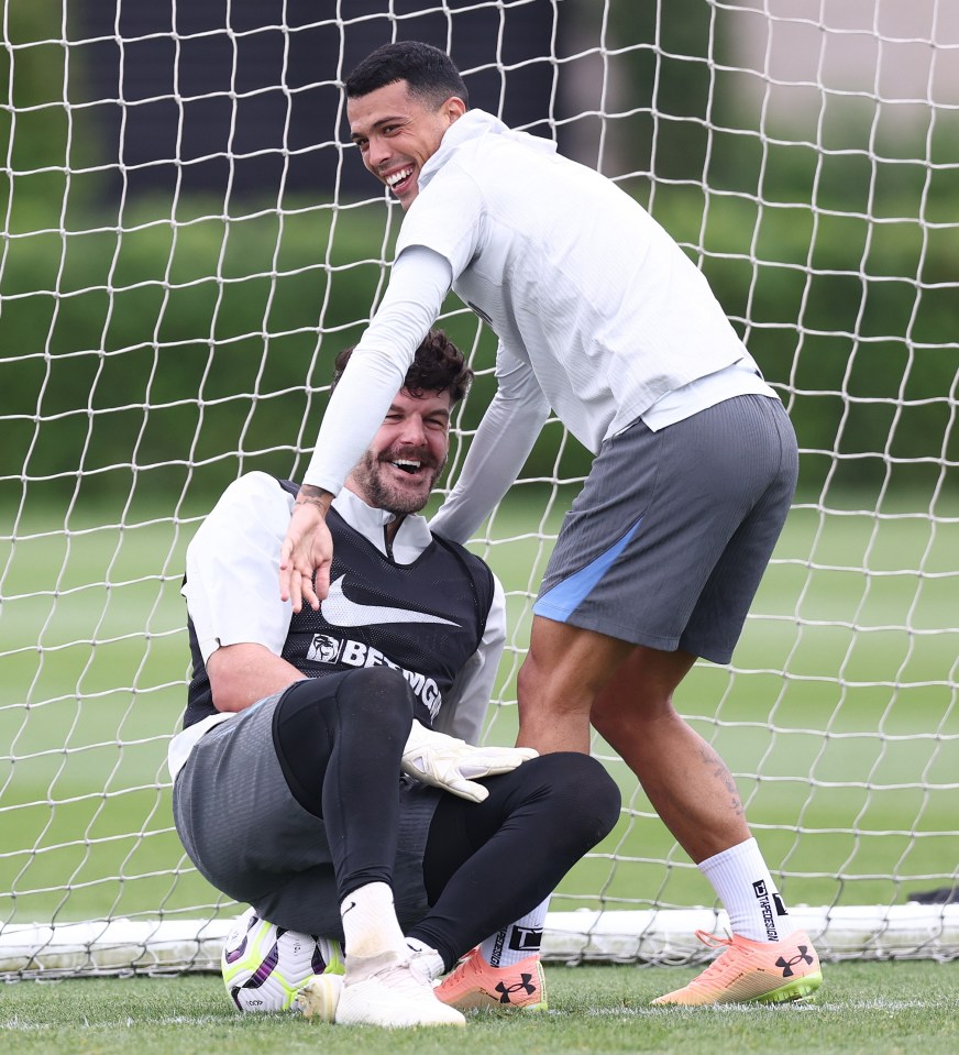 Teammates Pedro Porro and Fraser Forster mess about on the training ground