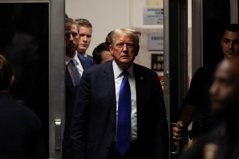 Donald Trump walks out of the Manhattan Criminal Courtroom