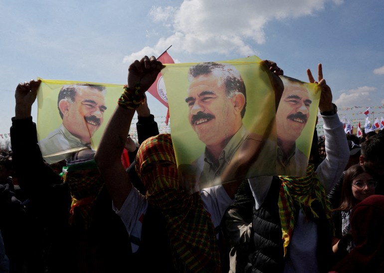 FILE PHOTO: Supporters of pro-Kurdish Peoples' Equality and Democracy Party (DEM Party) display flags with a portrait of jailed Kurdistan Workers Party (PKK) leader Abdullah Ocalan, during a rally to celebrate Nowruz, which marks the arrival of spring, in Istanbul, Turkey, March 17, 2024. REUTERS/Umit Bektas/File Photo