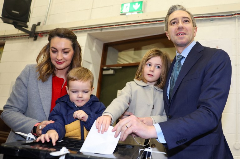 Ireland's Taoiseach (Prime Minister) and Fine Gael leader Simon Harris votes along with wife Caoimhe and children Cillian and Saoirse at a polling station in Delgany National School, during Ireland's general election, in Delgany, County Wicklow, Ireland, November 29, 2024. REUTERS/Toby Melville