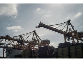 Cranes and shipping containers at the Port of Manzanillo in Manzanillo, Colima state, Mexico, on Tuesday, Nov. 19, 2024. Mexican President Claudia Sheinbaum is taking steps to cooperate with the US on issues like curbing migration and reducing Chinese imports, while avoiding openly taking sides in the global trade war. Photographer: Mayolo Lopez Gutierrez/Bloomberg