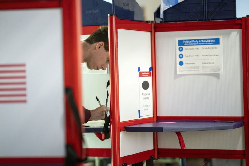 A Virginia resident fills in his ballot on Election Day at the Arlington Contemporary Arts Center in Arlington, Va., on Nov. 7, 2023. File Photo by Bonnie Cash/UPI